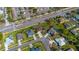 Aerial view of neighborhood with lush landscaping, sidewalks, and mature trees at 14296 Pullman Dr, Spring Hill, FL 34609