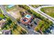 Aerial view of community pool, clubhouse, playground and manicured landscaping at 14296 Pullman Dr, Spring Hill, FL 34609