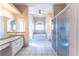 Bright bathroom featuring tiled floors, a soaking tub, and a separate shower stall at 14296 Pullman Dr, Spring Hill, FL 34609