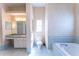 Bathroom with a soaking tub, a vanity with a mirror and a toilet at 14296 Pullman Dr, Spring Hill, FL 34609