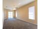 Large primary bedroom with carpeting, a ceiling fan, and sliding glass door at 14296 Pullman Dr, Spring Hill, FL 34609