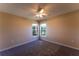 Cozy bedroom featuring neutral walls, carpet, a ceiling fan, and bright windows for natural light at 14296 Pullman Dr, Spring Hill, FL 34609