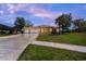 Charming single-story home featuring a three-car garage and well-manicured lawn at 14296 Pullman Dr, Spring Hill, FL 34609