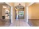Inviting foyer showcases tile flooring and views into the living room and kitchen at 14296 Pullman Dr, Spring Hill, FL 34609