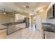 Modern kitchen featuring granite countertops, white cabinets, and stainless steel appliances at 14296 Pullman Dr, Spring Hill, FL 34609