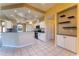 Bright kitchen with white cabinets, stainless steel appliances, and granite countertops at 14296 Pullman Dr, Spring Hill, FL 34609
