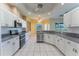 Bright and spacious kitchen with granite countertops and white cabinets at 14296 Pullman Dr, Spring Hill, FL 34609