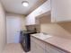 Laundry room with new appliances and cabinets at 14296 Pullman Dr, Spring Hill, FL 34609
