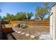 A backyard with a wooden fence, a fire pit, and a shed at 14323 83Rd Pl, Seminole, FL 33776
