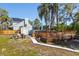A backyard with a shed, fire pit and wooden deck at 14323 83Rd Pl, Seminole, FL 33776
