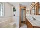 Bathroom featuring a walk in shower, single sink vanity, and neutral tiling at 14323 83Rd Pl, Seminole, FL 33776
