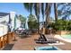 Deck features a table, chairs and fire pit at 14323 83Rd Pl, Seminole, FL 33776