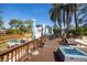 Deck features a table, chairs and fire pit at 14323 83Rd Pl, Seminole, FL 33776