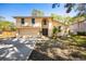 Charming two-story home featuring a two-car garage, a well-maintained front yard, and beautiful landscaping at 14323 83Rd Pl, Seminole, FL 33776