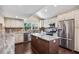 Modern kitchen with updated appliances and granite countertops at 14323 83Rd Pl, Seminole, FL 33776