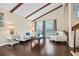 Cozy living room features beamed ceilings, a large window, and hardwood floors at 14323 83Rd Pl, Seminole, FL 33776