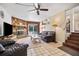 Spacious living room with stone fireplace and access to the outdoor pool area at 14323 83Rd Pl, Seminole, FL 33776