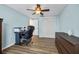 Office featuring hardwood floors, ceiling fan, work station and closet at 14323 83Rd Pl, Seminole, FL 33776