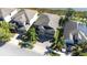 An aerial view of a well-maintained home with a two-car garage and nicely landscaped yard at 1564 Imperial Key Dr, Trinity, FL 34655