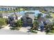 Aerial view of neighborhood showcasing the property's prime lakefront location and lush landscaping at 1564 Imperial Key Dr, Trinity, FL 34655