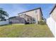Exterior view of the screened patio and backyard, blending indoor/outdoor living at 1564 Imperial Key Dr, Trinity, FL 34655
