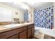 Traditional bathroom featuring double sinks, and a shower/tub combo at 1564 Imperial Key Dr, Trinity, FL 34655