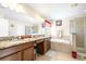 Bright bathroom features a soaking tub and separate shower, perfect for relaxation at 1564 Imperial Key Dr, Trinity, FL 34655