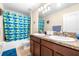 Bathroom featuring double sinks, modern fixtures, and a shower/tub combo at 1564 Imperial Key Dr, Trinity, FL 34655