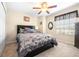 Bedroom features neutral walls, ceiling fan, carpeted floor and window at 1564 Imperial Key Dr, Trinity, FL 34655