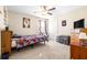 Bedroom with carpet and fan offers neutral colors and good closet space at 1564 Imperial Key Dr, Trinity, FL 34655