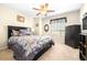 Bedroom features neutral walls, ceiling fan, carpeted floor and window at 1564 Imperial Key Dr, Trinity, FL 34655