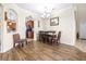 Dining area with hardwood flooring, neutral walls, and a modern chandelier lighting at 1564 Imperial Key Dr, Trinity, FL 34655