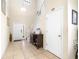 Bright foyer with high ceilings, tile flooring, a staircase, and a white front door at 1564 Imperial Key Dr, Trinity, FL 34655