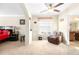 Spacious main bedroom featuring a seating area, ceiling fan and neutral walls at 1564 Imperial Key Dr, Trinity, FL 34655