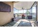 Relaxing screened patio with stylish furniture, fan, grill, and serene lake views at 1564 Imperial Key Dr, Trinity, FL 34655