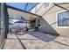 Covered patio with comfortable seating and grill, perfect for outdoor entertaining and relaxing at 1564 Imperial Key Dr, Trinity, FL 34655