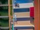 Overhead view of balconies and water access featuring outdoor furniture and a red awning at 161 Brightwater Dr # 8, Clearwater Beach, FL 33767