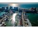 Scenic aerial view of a coastal community with waterfront homes, docks, and the ocean in the background at 161 Brightwater Dr # 8, Clearwater Beach, FL 33767