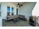 Outdoor balcony with comfortable seating, ceiling fan, and an outdoor grill at 161 Brightwater Dr # 8, Clearwater Beach, FL 33767