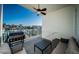 Relaxing balcony area with grill, seating, and a scenic view of the water at 161 Brightwater Dr # 8, Clearwater Beach, FL 33767