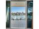 Balcony view overlooking boats, docks, and cityscape, perfect spot for relaxation and enjoying the coastal scenery at 161 Brightwater Dr # 8, Clearwater Beach, FL 33767