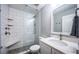 Bathroom featuring a stand-up shower, modern fixtures, and a vanity with countertop at 161 Brightwater Dr # 8, Clearwater Beach, FL 33767