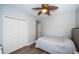 Cozy bedroom with ceiling fan, closet, neutral color palette, and wood-look flooring at 161 Brightwater Dr # 8, Clearwater Beach, FL 33767