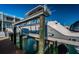 Convenient boat lift providing easy access to the water, perfect for boating enthusiasts and waterfront living at 161 Brightwater Dr # 8, Clearwater Beach, FL 33767