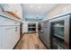 Modern kitchen has stainless steel appliances, two ovens, and a beverage refrigerator at 161 Brightwater Dr # 8, Clearwater Beach, FL 33767