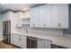 Contemporary kitchen featuring white cabinets, stainless steel appliances, and sleek countertops for a modern look at 161 Brightwater Dr # 8, Clearwater Beach, FL 33767