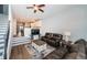 Open concept living room has a large leather couch and stairs to the second story at 161 Brightwater Dr # 8, Clearwater Beach, FL 33767