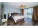 Cozy main bedroom with balcony, offering waterfront views and ample space to relax, in a desirable coastal setting at 161 Brightwater Dr # 8, Clearwater Beach, FL 33767