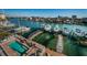 Relaxing pool area with waterfront views, docks, and boats creating an ideal setting for leisure and recreation at 161 Brightwater Dr # 8, Clearwater Beach, FL 33767