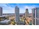 Aerial view showcasing modern high-rise buildings, a rooftop pool, and lush landscaping at 175 1St S St # 3008, St Petersburg, FL 33701